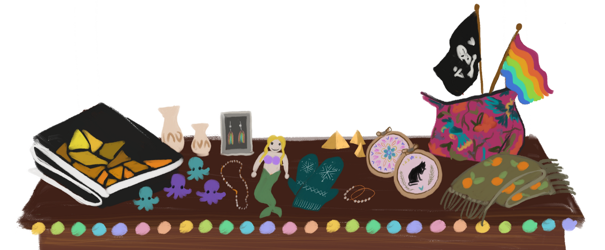 Digital drawing of a craft market table display with a folded quilt, tiny octopi, jewelry, vases, gloves, a merperson, needlework, a bag, a scard, and two small flags (Pride and Blackbeard's pirate flag)
